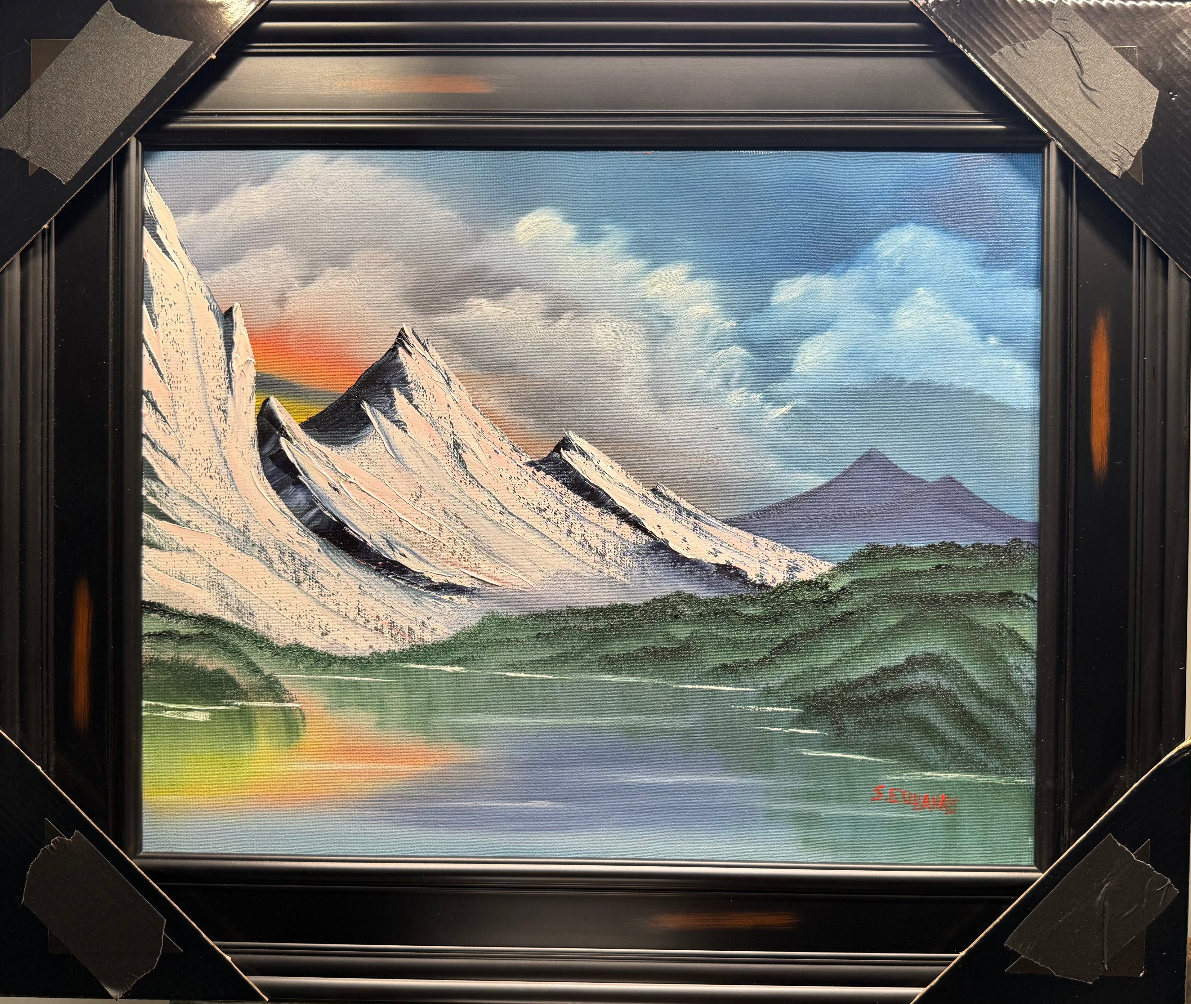 BLACK TAPE Series: (2) Oil painting on 16x20 canvas set with black frame. Mountain landscape with foot hills, on a peaceful lake.