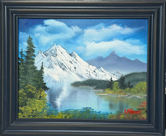 5 Oil painting on 11x14 canvas set within  beautiful dark blue frame. Mountain landscape with lake, trees and mountain range.