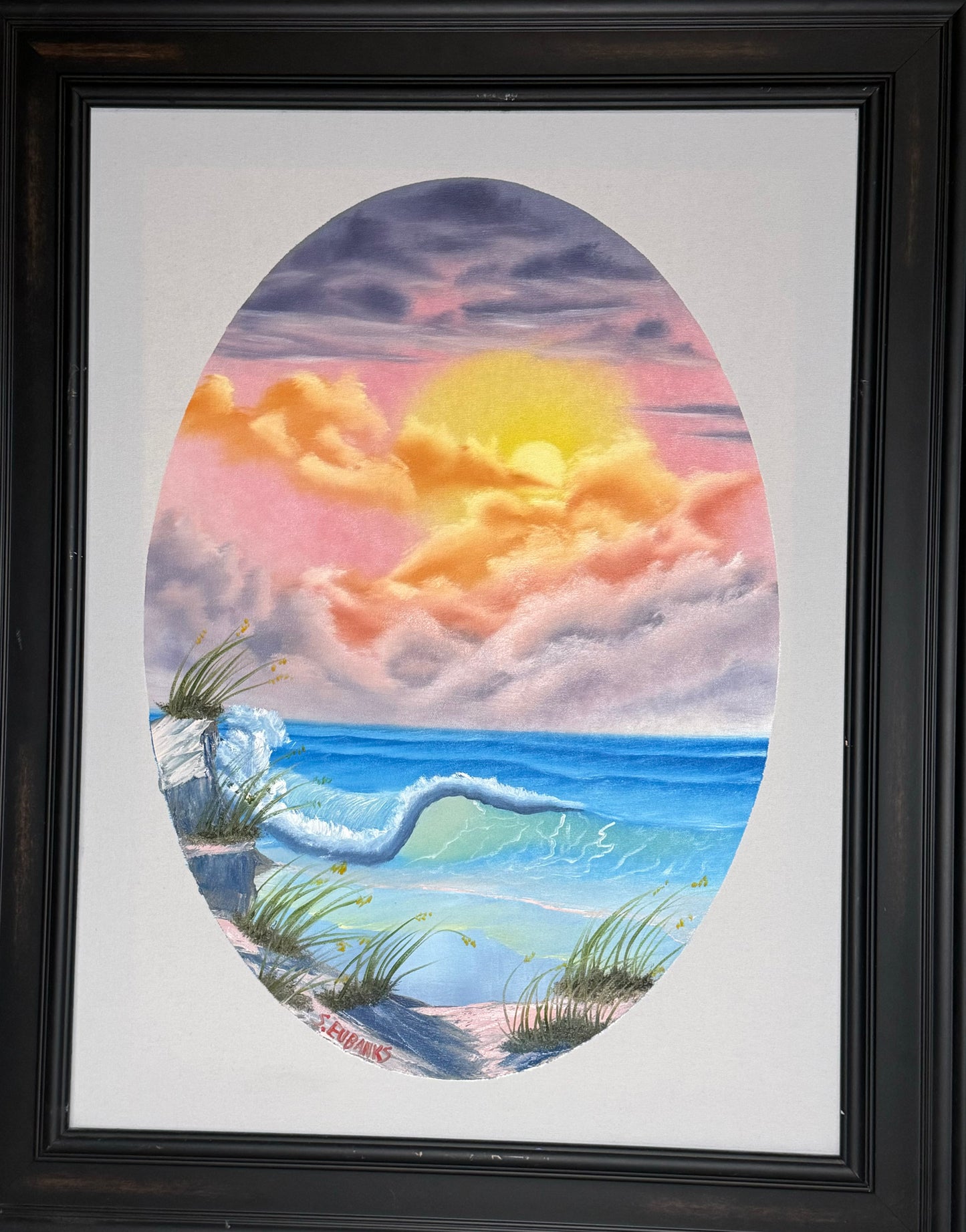 3 Oil painting on 18x24 canvas set within black frame, oval seascape with sun setting and large breaking wave.